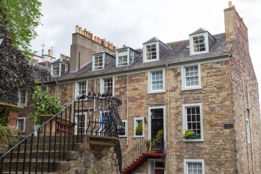 Edinburgh, Scotland, UK - 11 August 2018: Characteristic stone buildings of the old town. The facade of a historic tenement house.