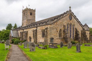 Kirkby Lonsdale, Cumbria, England - 12 August 2018: View of the Saint Mary Church, active Anglican parish church in the deanery of Kendal. The church contains Norman architecture.