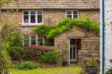 Dent, Cumbria, UK, 12 August 2018 - Facade of a stone building in the village of Dent in the Yorkshire Dales, UK