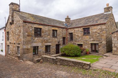 Dent, Cumbria, UK, 12 August 2018 - Facade of a stone building in the village of Dent in the Yorkshire Dales, UK