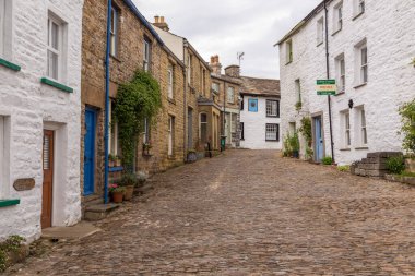 Dent, Cumbria, UK, 12 August 2018 - Facade of a stone building in the village of Dent in the Yorkshire Dales, UK