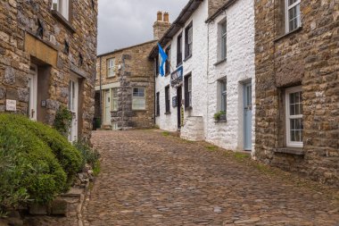 Dent, Cumbria, UK, 12 August 2018 - Facade of a stone building in the village of Dent in the Yorkshire Dales, UK