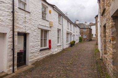 Dent, Cumbria, UK, 12 August 2018 - Facade of a stone building in the village of Dent in the Yorkshire Dales, UK