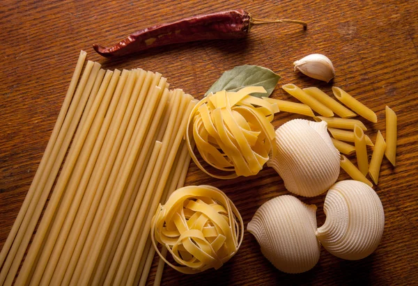 Uncooked pasta spaghetti macaron — Stock Photo, Image