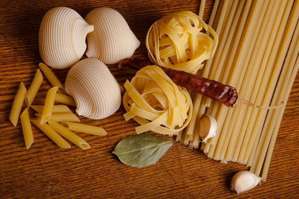 Uncooked pasta spaghetti macaron — Stock Photo, Image