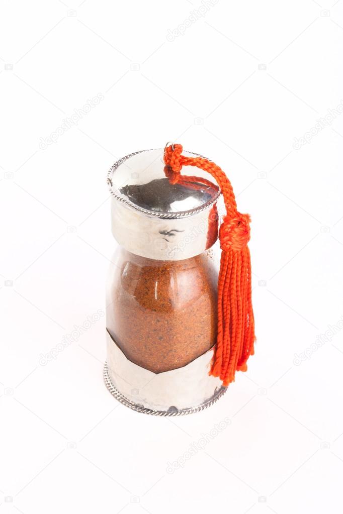 Spices in glass jar on white background