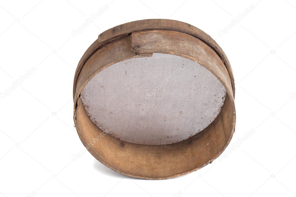 Old wooden sieve for flour isolated on white background