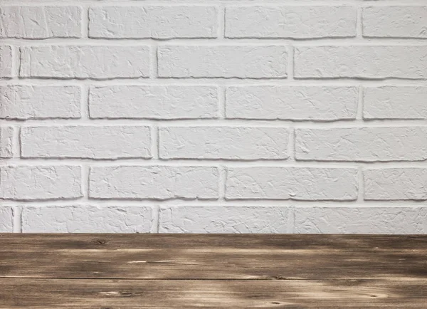 Background with texture of white brick rough wall and wooden floor in loft style with copy space Stockbild