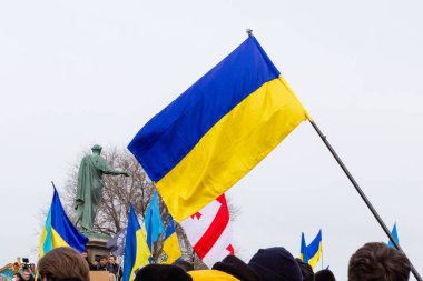ODESSA, UKRAINE - 20 FEB 2022: Unity march in Odessa against Russian invasion. Odessa statue of Duk shows on Ukrainian flag. Message Odessa in Ukrainian city. clipart