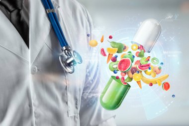 Doktorun arka planında meyve ve vitamin içeren tıbbi kapsüller şeklinde gıda takviyesi. Doğru diyet, diyet, alternatif tıp, vitaminler, naturopati, homeopati.