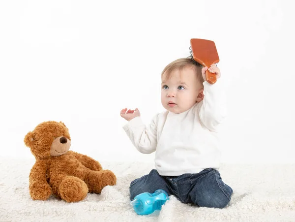 Stock Studio Photo White Background Baby Combing His Hair Teddy — 스톡 사진