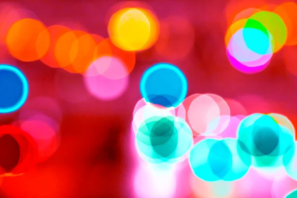 Sparkle light bokeh. Sparkle green, yellow, white, pink, blue and red bokeh of light with red pink background.