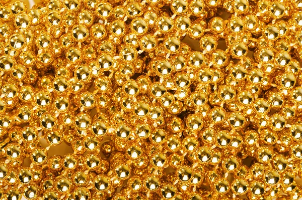 Viele kleine goldene Kugeln — Stockfoto