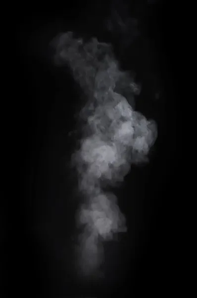 Humo sobre el fondo negro Imagen de stock