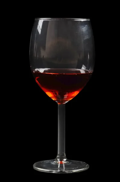 Rött vin glas på svart — Stockfoto