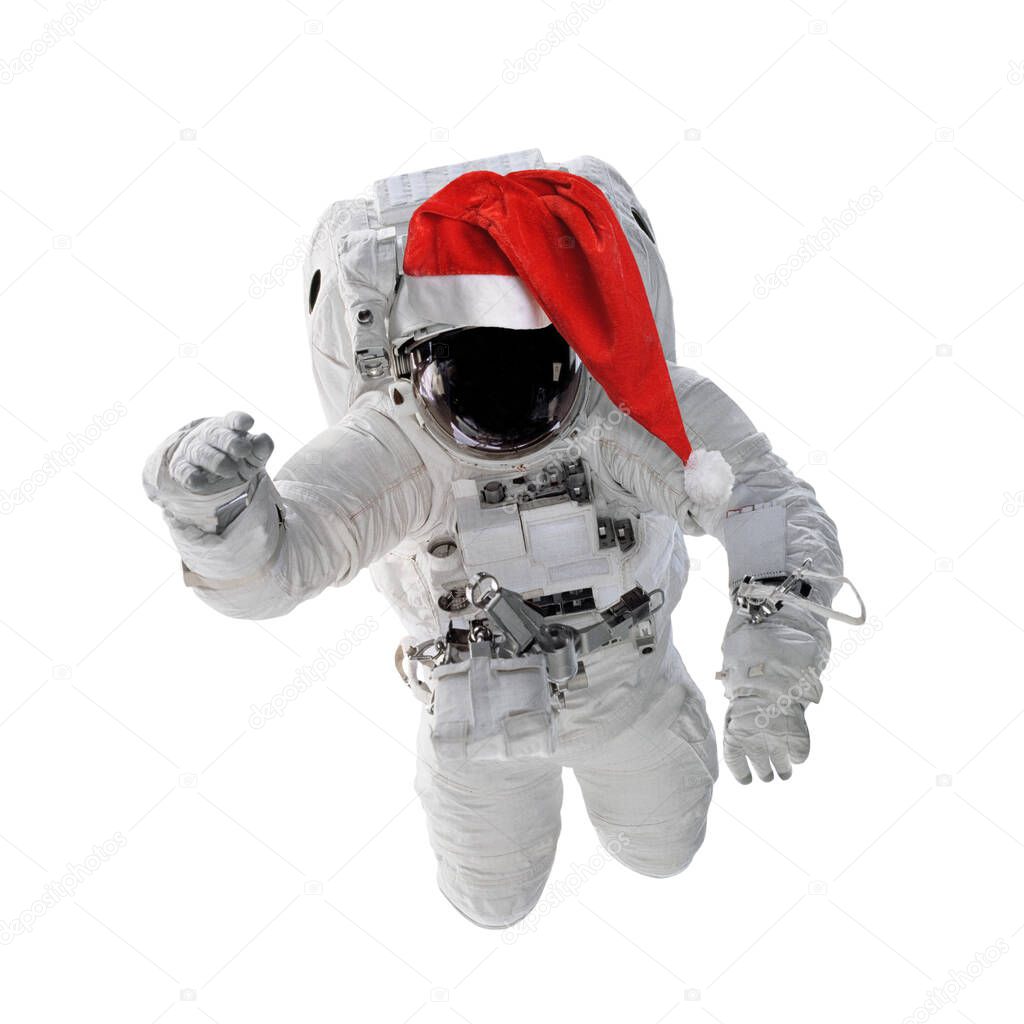 Astronaut in space suit and red santa hat isolated. Elements of this image furnished by NASA