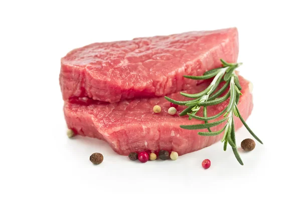 Raw beef steak with rosemary — Stock Photo, Image