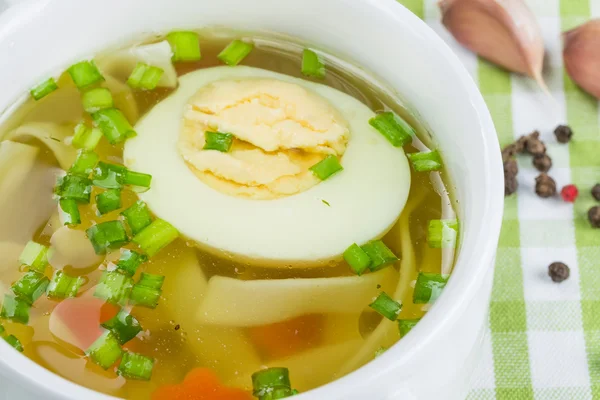 Hot soup with boiled egg — Stock Photo, Image