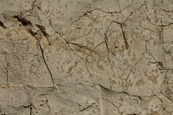 Textur der alten Mauer mit Rissen. — Stockfoto