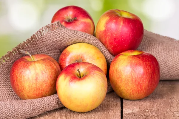 Apples on an old wooden surface. — Stock Photo, Image