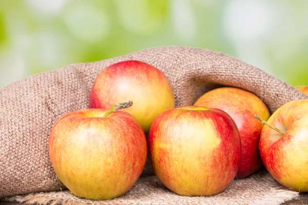 Apples on an old wooden — Stock Photo, Image