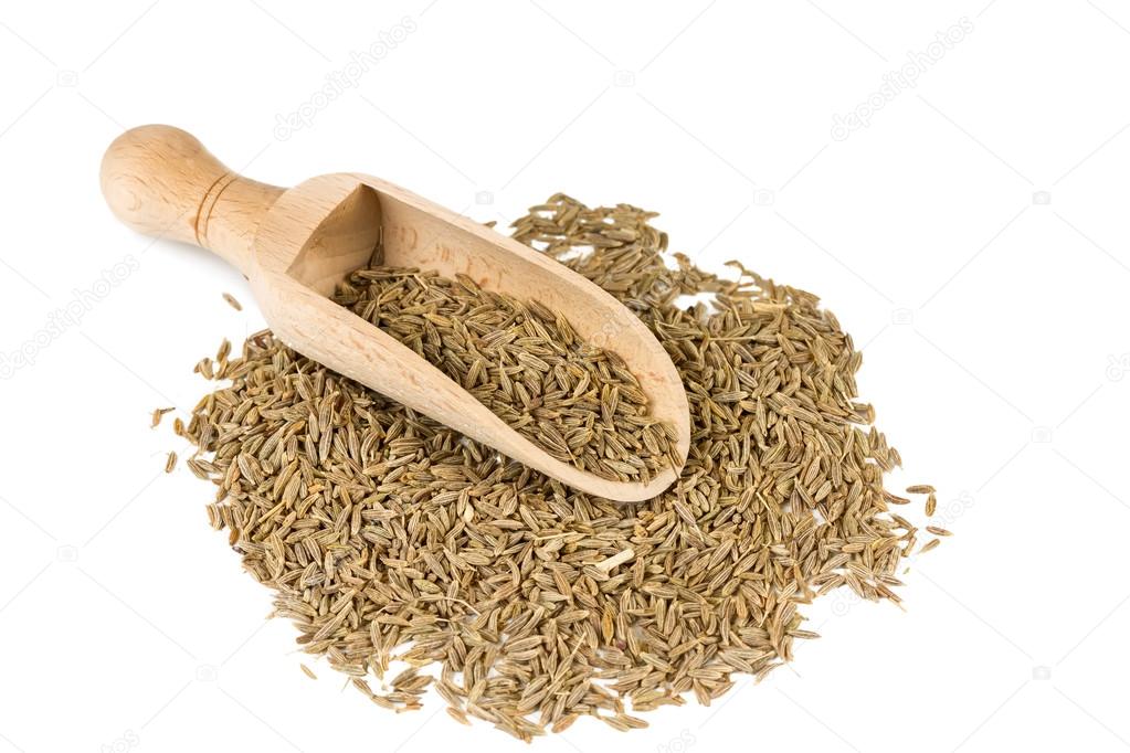 Cumin seeds in a spoon for spices