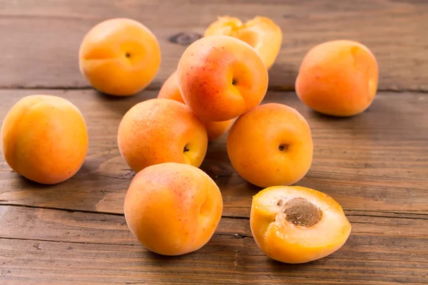 Apricots on a wooden surface — Stock Photo, Image