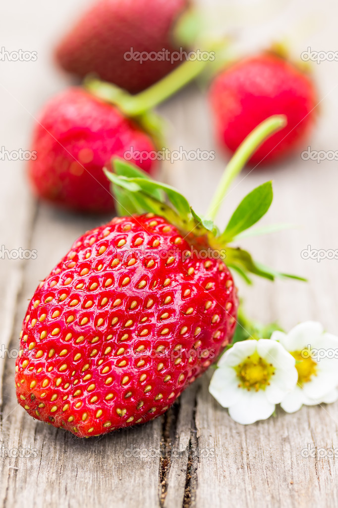 Berries Strawberries onwooden board.