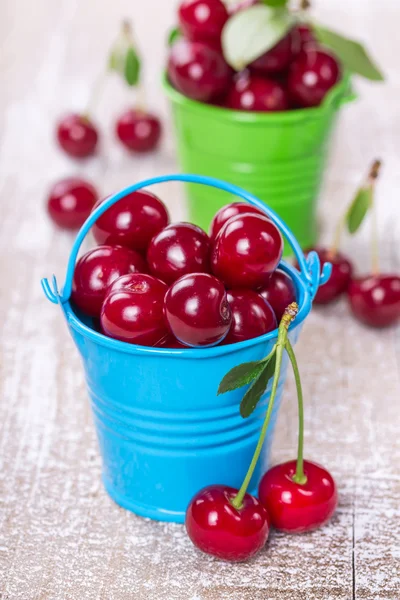 Two buckets with a cherry — Stock Photo, Image