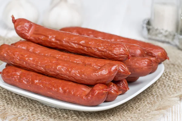 Bavarian sausages on a white plate — Stock Photo, Image
