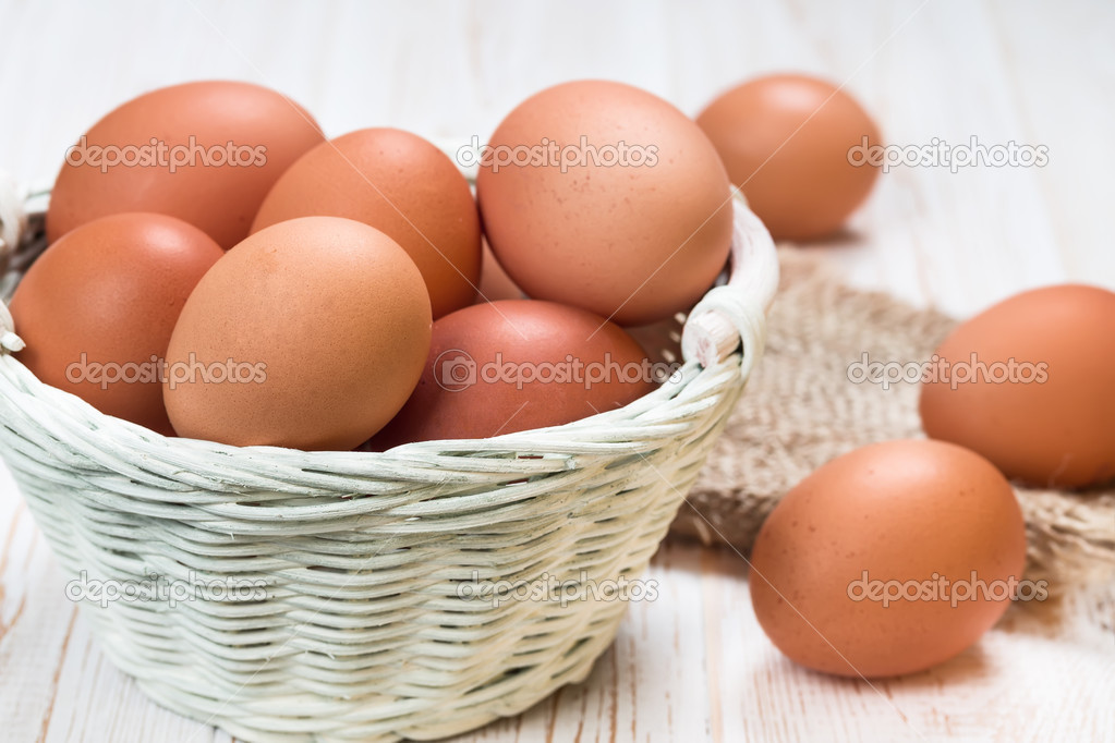 Chicken eggs in a wicker basket