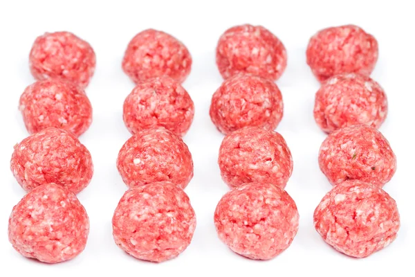 Raw meatballs on white — Stock Photo, Image