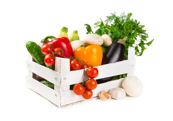 Fresh vegetables in a painted wooden box — Stock Photo, Image