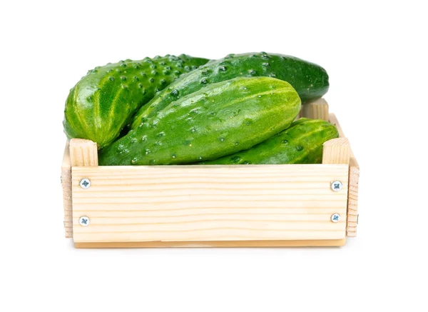 Cucumbers in a wooden box — Stock Photo, Image