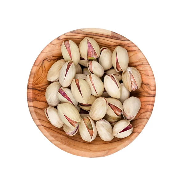 Pistachios in a wooden bowl — Stock Photo, Image