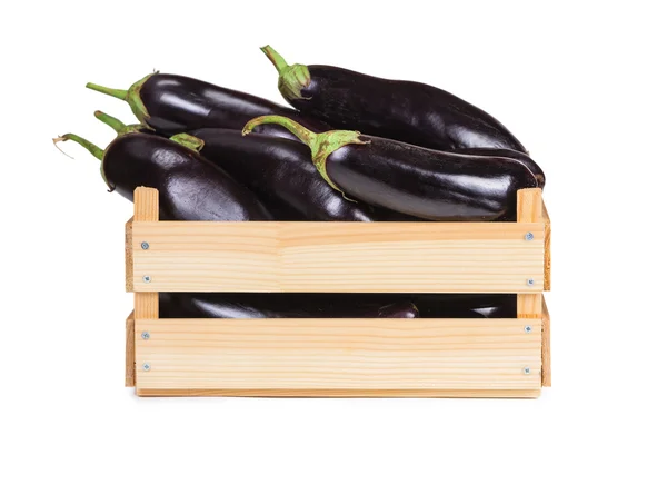 Ripe eggplant in a wooden box — Stock Photo, Image