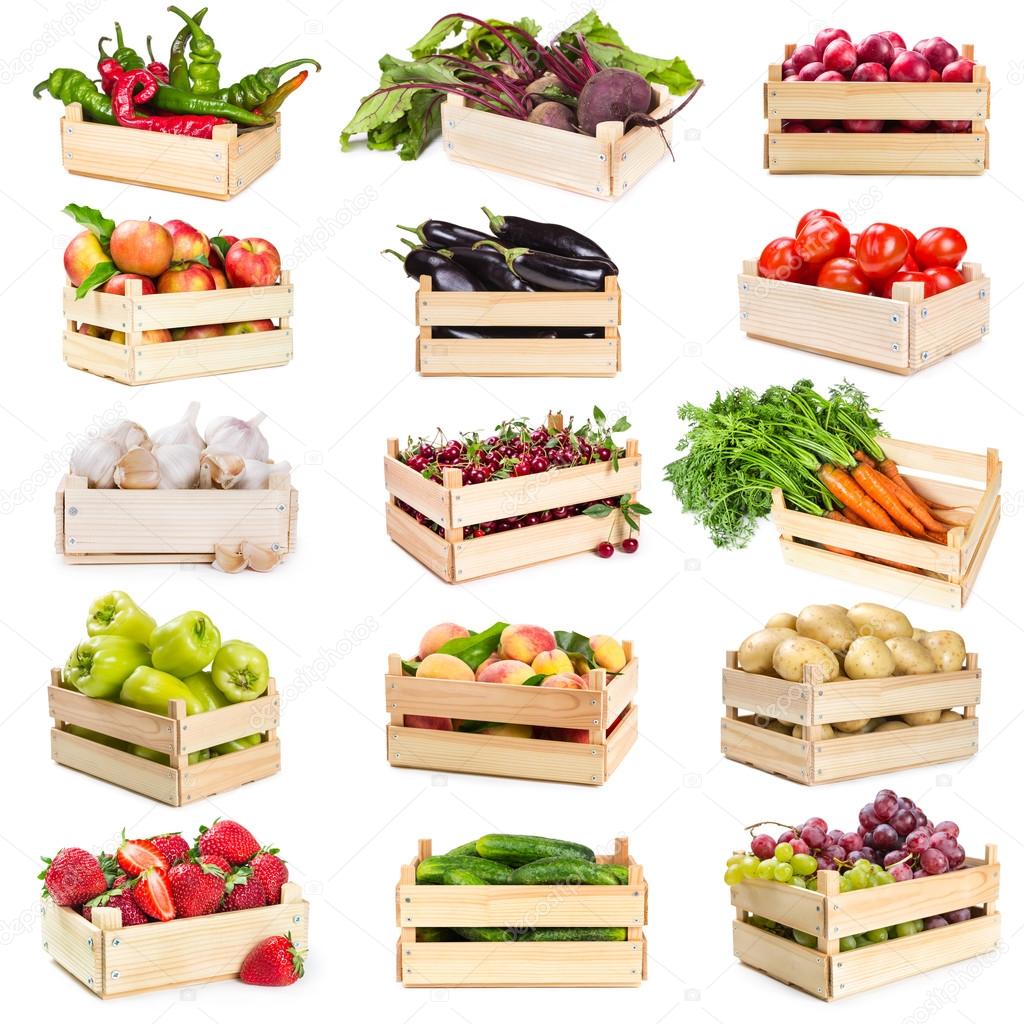Set of wooden boxes with vegetables, fruits and berries  