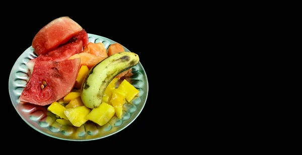Plate Different Fruits Black Background — Zdjęcie stockowe
