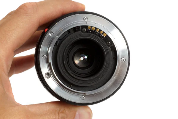 Photographic objective in a hand — Stock Photo, Image