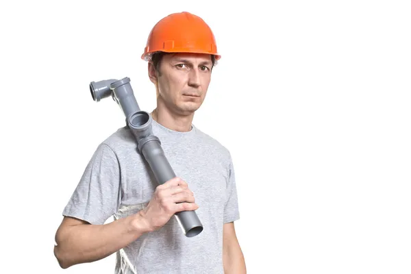 The young working plumber with the tool — Stock Photo, Image