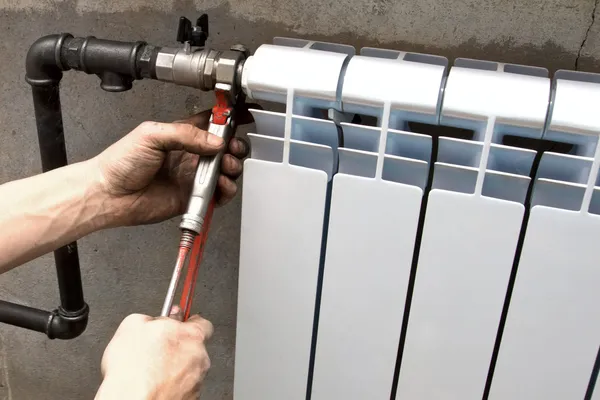 Installation of a radiator — Stock Photo, Image