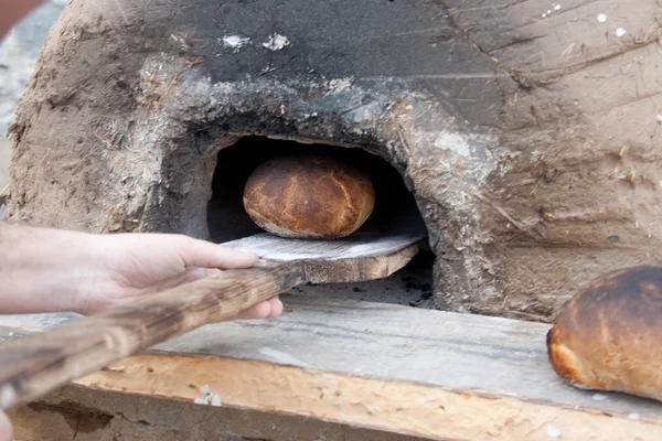 Traditional bread made in medieval oven. — Stock Photo, Image