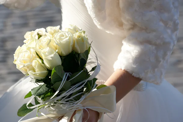 Bride holding wedding bouquet — Stock Photo, Image