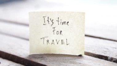 Its travel time. Paper card with an inscription. Summer Vacations idea. High quality FullHD footage