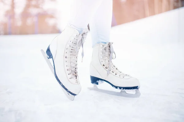 Close-up of women figure skates on ice rink in winter — Stock Photo, Image