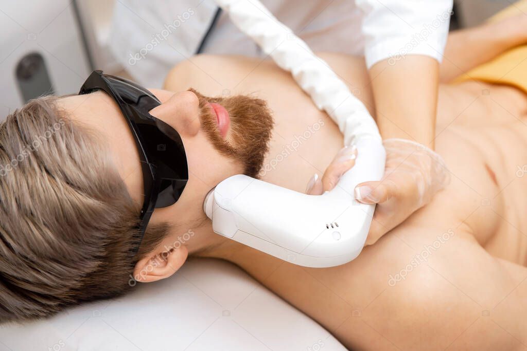 Man face mustache and beard laser epilation hair removal procedure