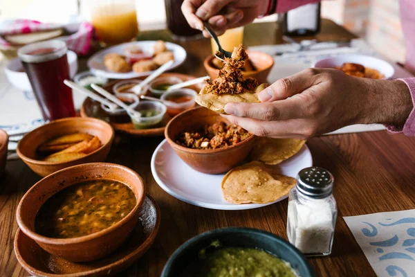 Hand Man Eating Mexican Tostadas Tacos Tortillas Traditional Food Table — Stock Photo, Image