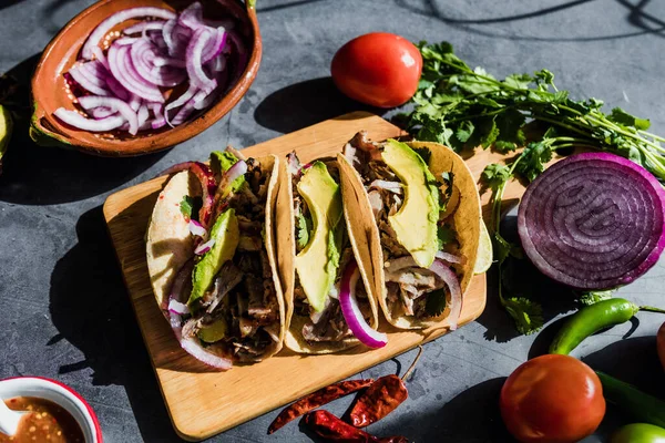 stock image mexican street tacos with lemon, sauce, onion and cilantro Traditional food in Mexico city