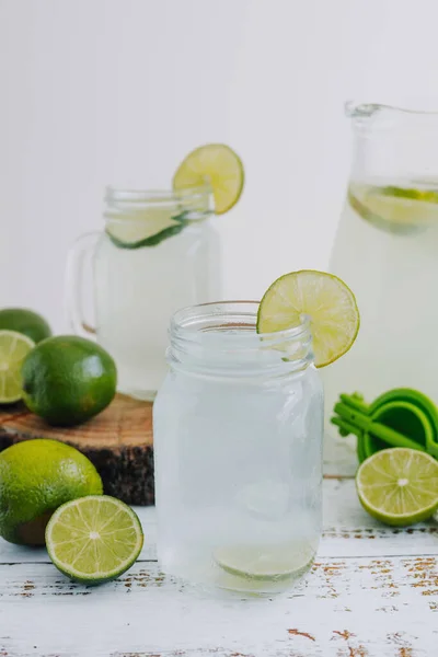 Jar Glass Lemonade Drink Green Lemons Lime White Background Latin —  Fotos de Stock