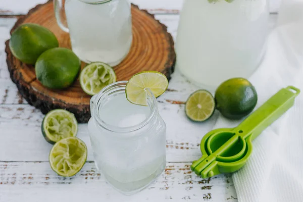 Jar Glass Lemonade Drink Green Lemons Lime White Background Latin — Stock Fotó